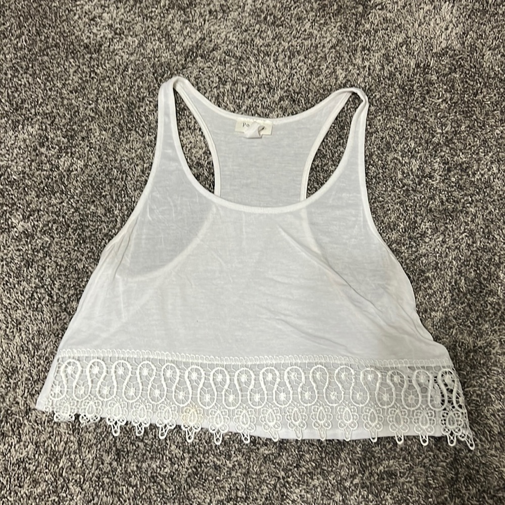 Sheer razor back crop top. Front has lace detail at the bottom